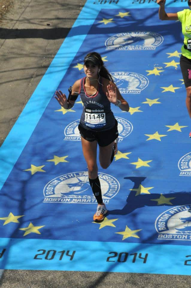 woman crossing the finish line at a race